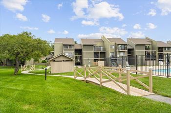Wooden bridge with external view of property at Bremerton Park Apartment Homes , Prairie Village, Kansas
